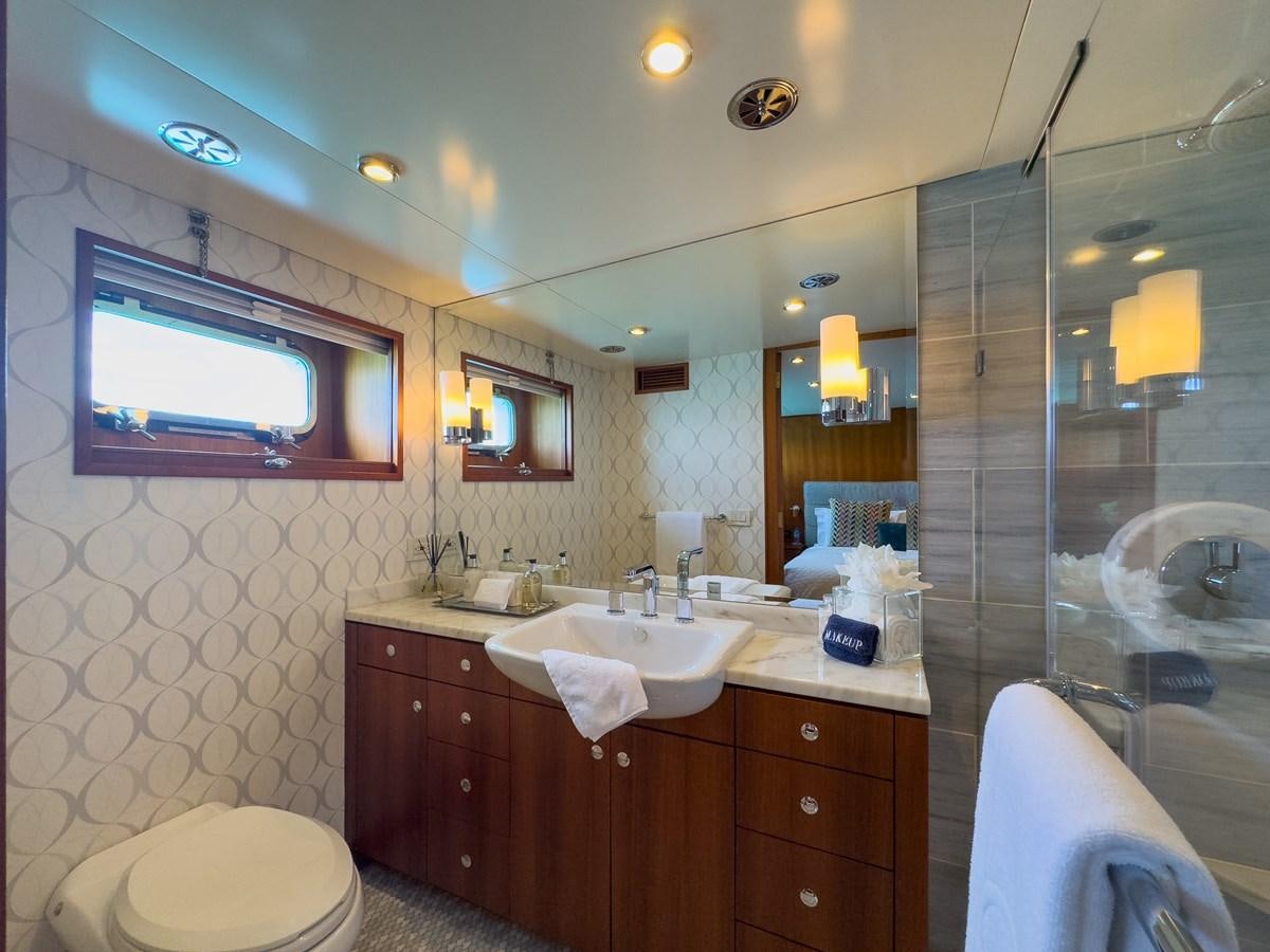 a bathroom with a large mirror aboard CALYPSO Yacht for Sale