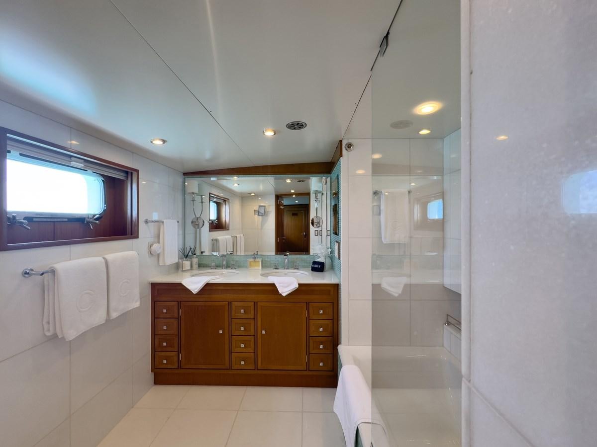 a bathroom with a glass shower aboard CALYPSO Yacht for Sale
