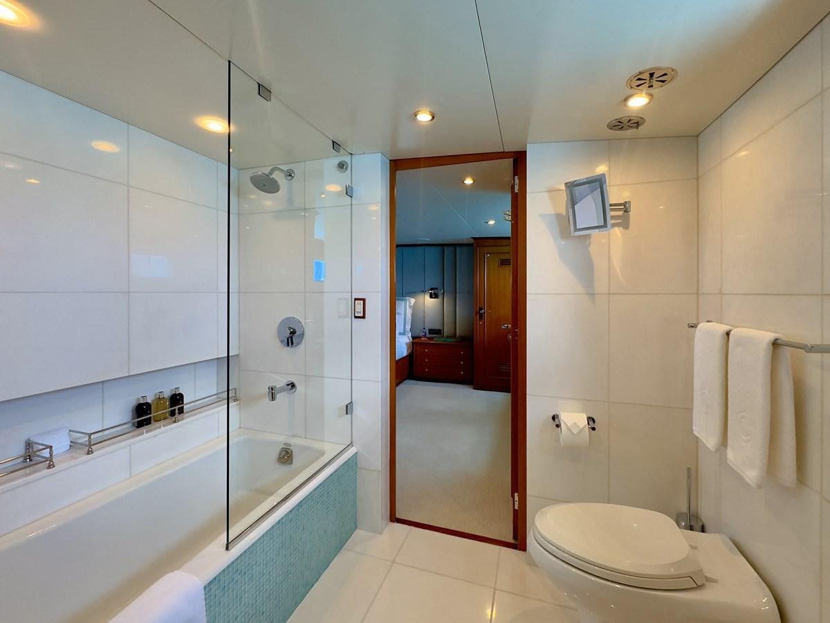 a bathroom with a glass shower aboard CALYPSO Yacht for Sale