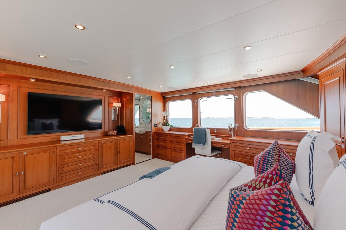 a bedroom with a bed and tv aboard CALYPSO Yacht for Sale