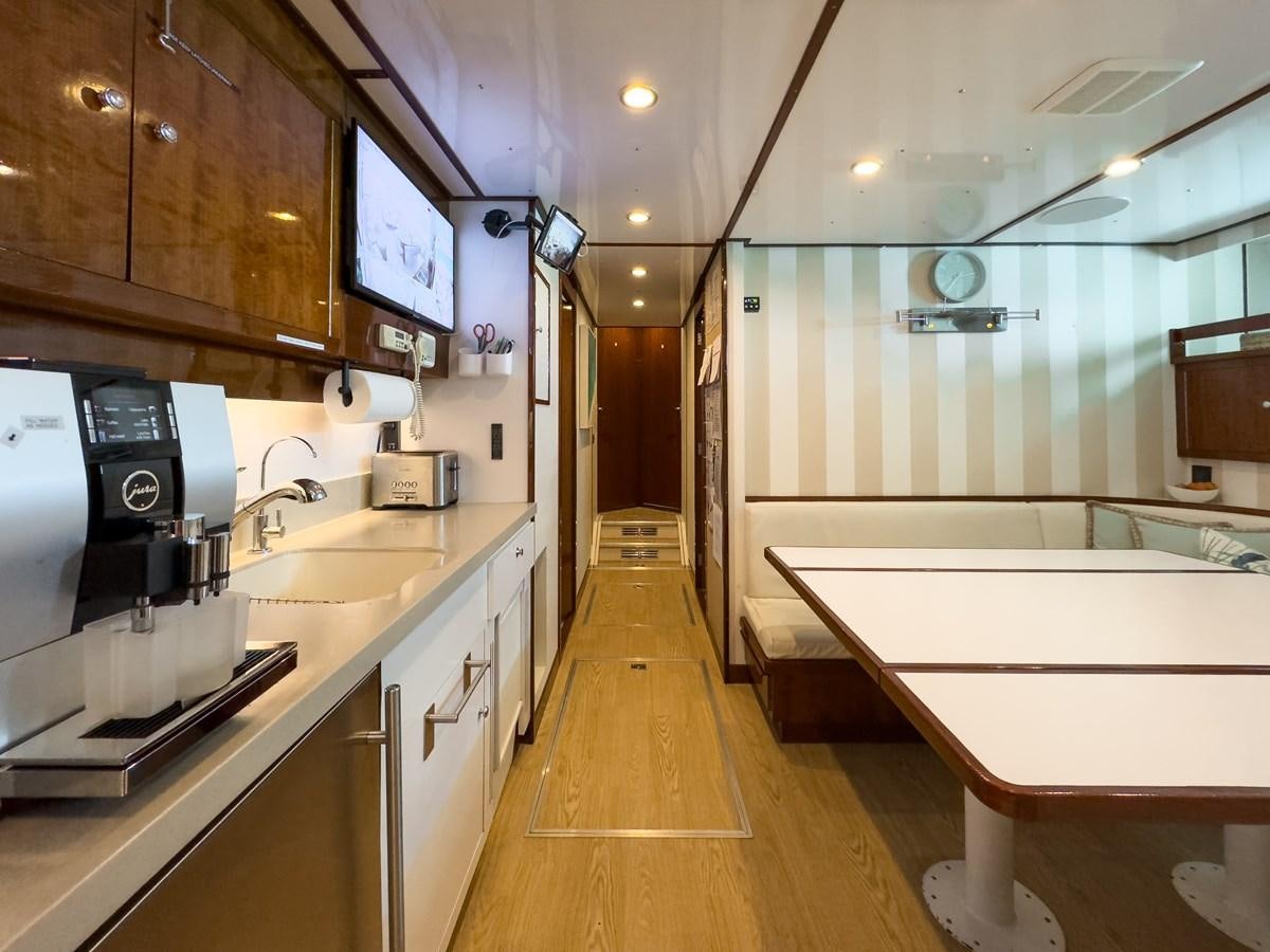 a kitchen with a large island aboard CALYPSO Yacht for Sale