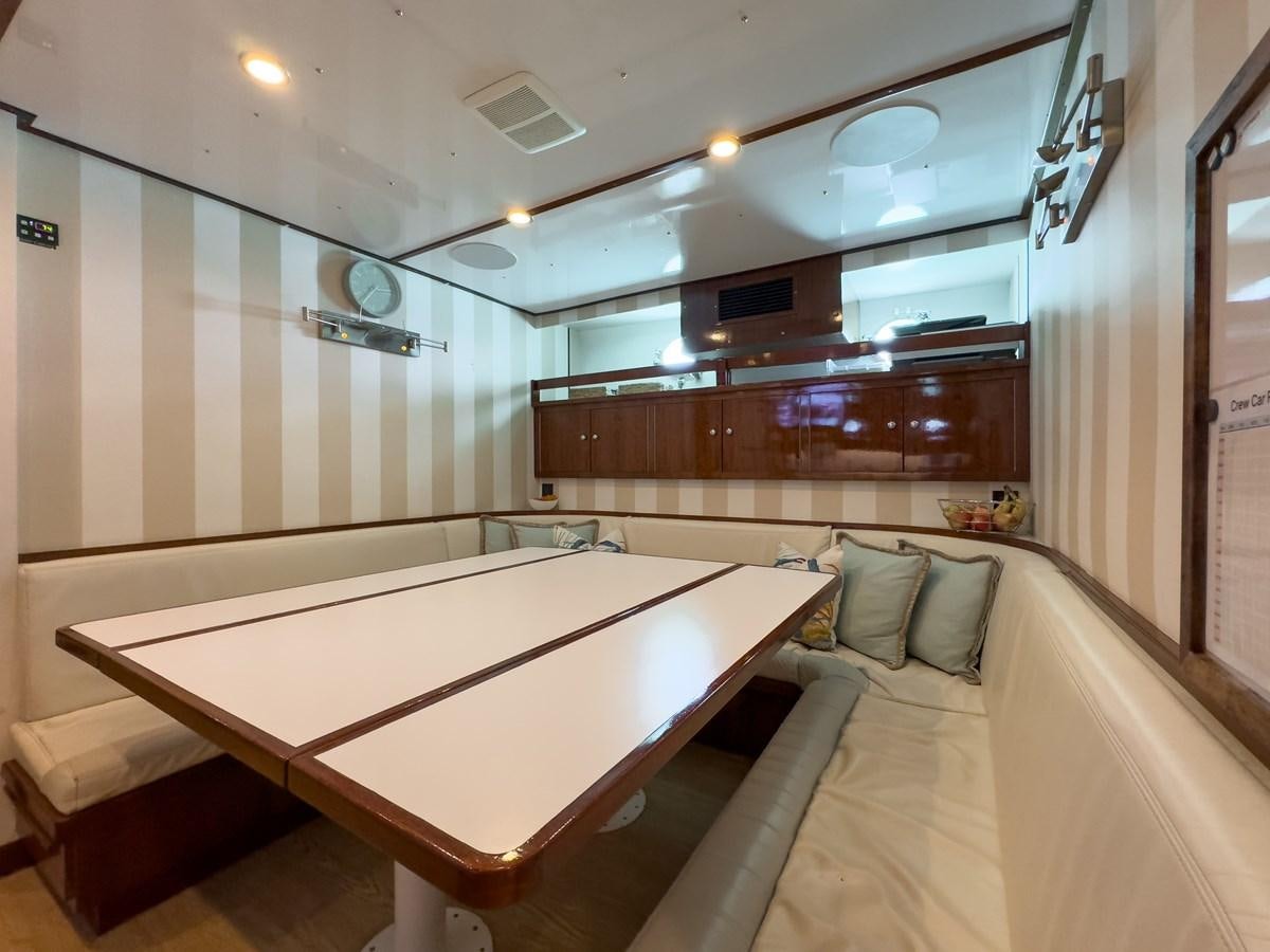 a room with a bed and a large mirror aboard CALYPSO Yacht for Sale