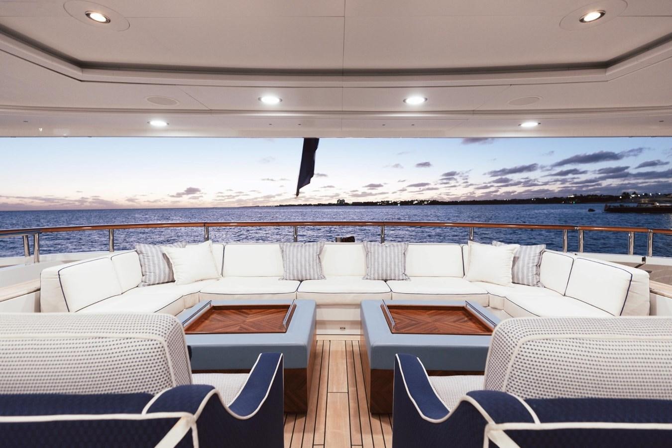 a room with a view of the water and the mountains in the background aboard LADY B Yacht for Sale