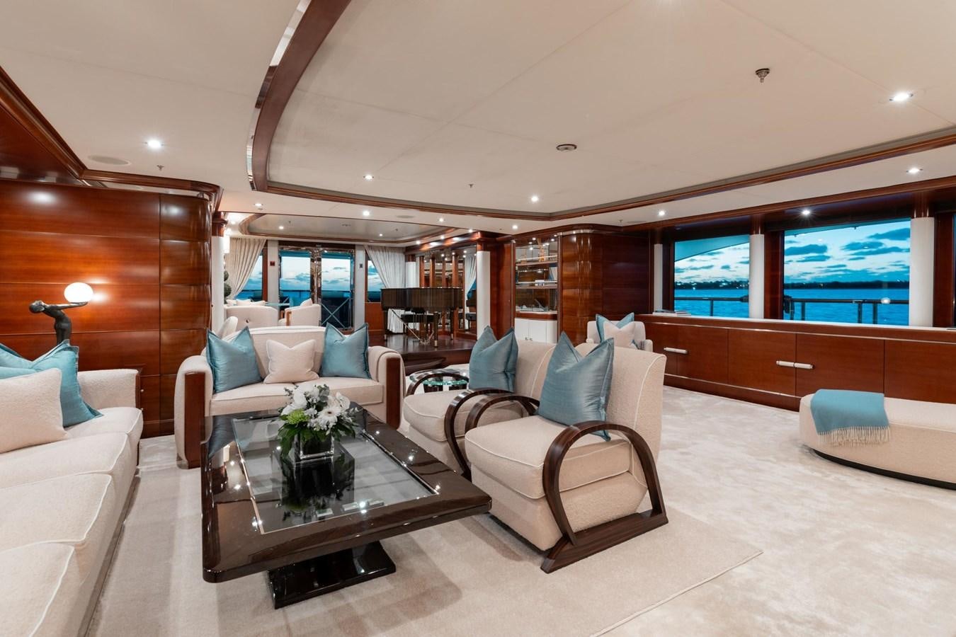 a living room with a couch and a coffee table aboard LADY B Yacht for Sale