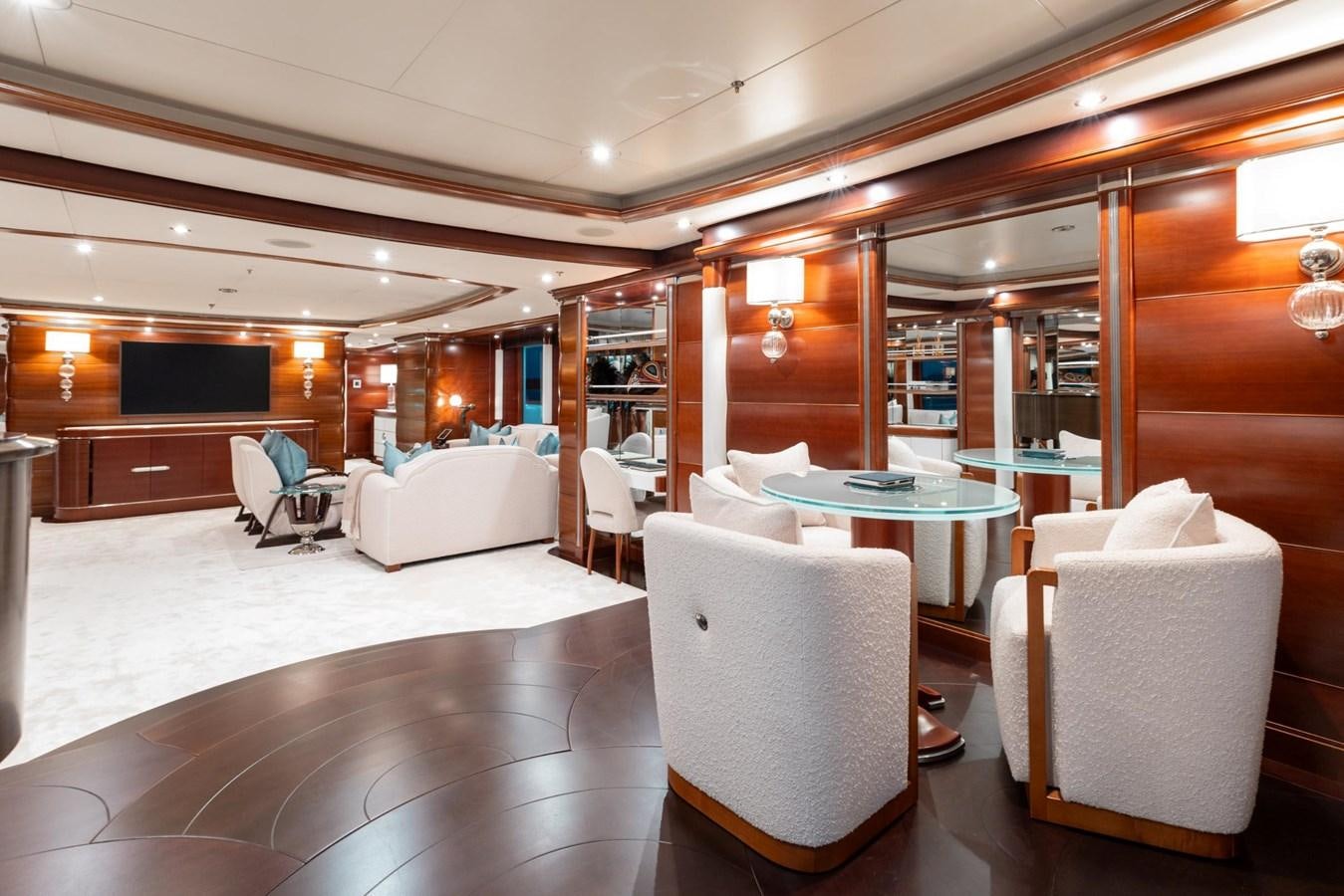 a room with a table chairs and a couch aboard LADY B Yacht for Sale