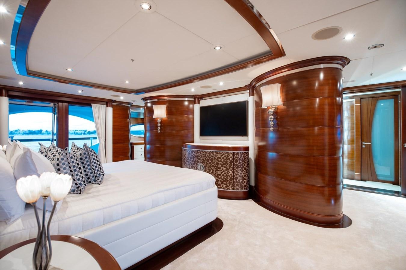 a hotel room with a bed and a tv aboard LADY B Yacht for Sale