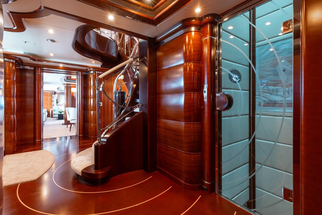 a large room with glass walls aboard LADY B Yacht for Sale