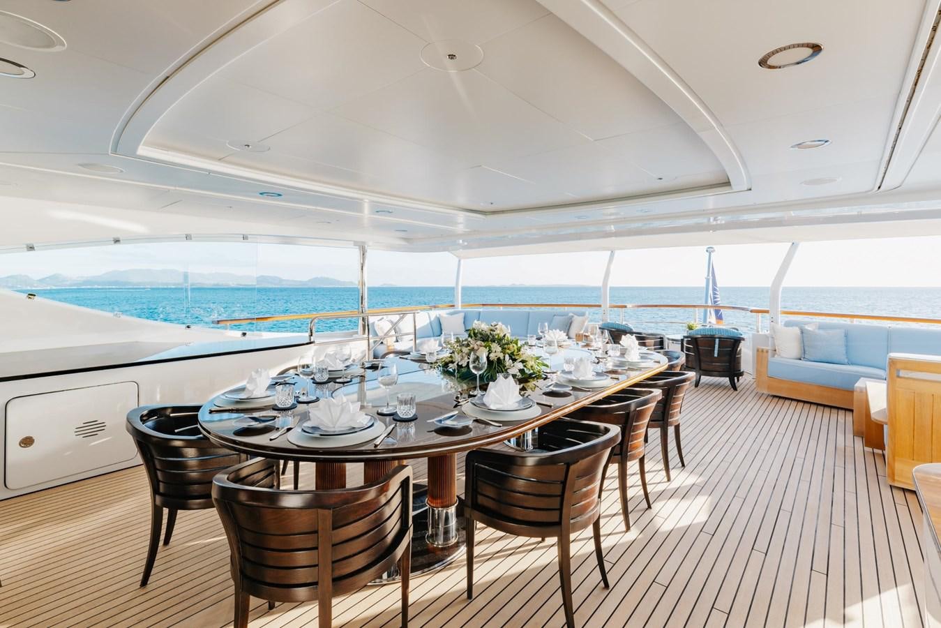 a dining table on a deck aboard LADY B Yacht for Sale