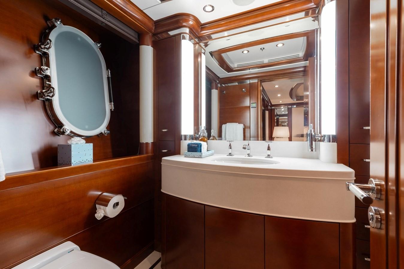 a bathroom with a large mirror aboard LADY B Yacht for Sale