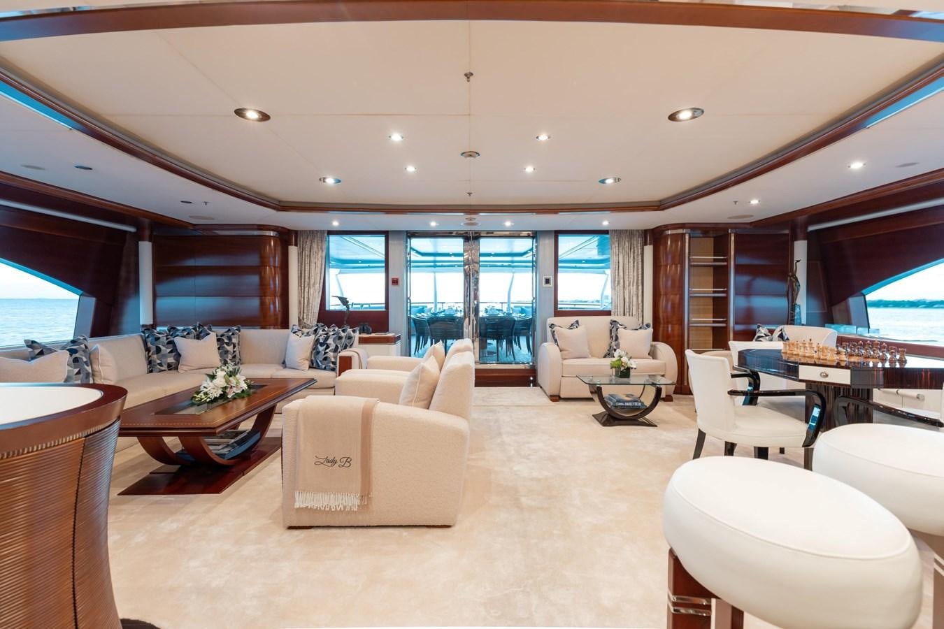 a living room with a large window aboard LADY B Yacht for Sale