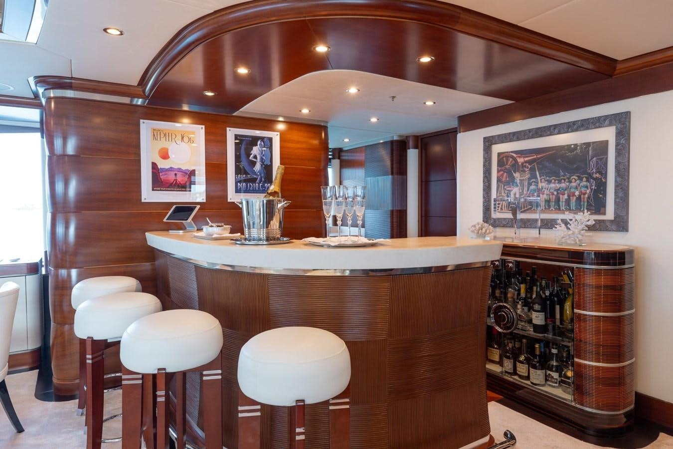 a bar with stools and a bar aboard LADY B Yacht for Sale
