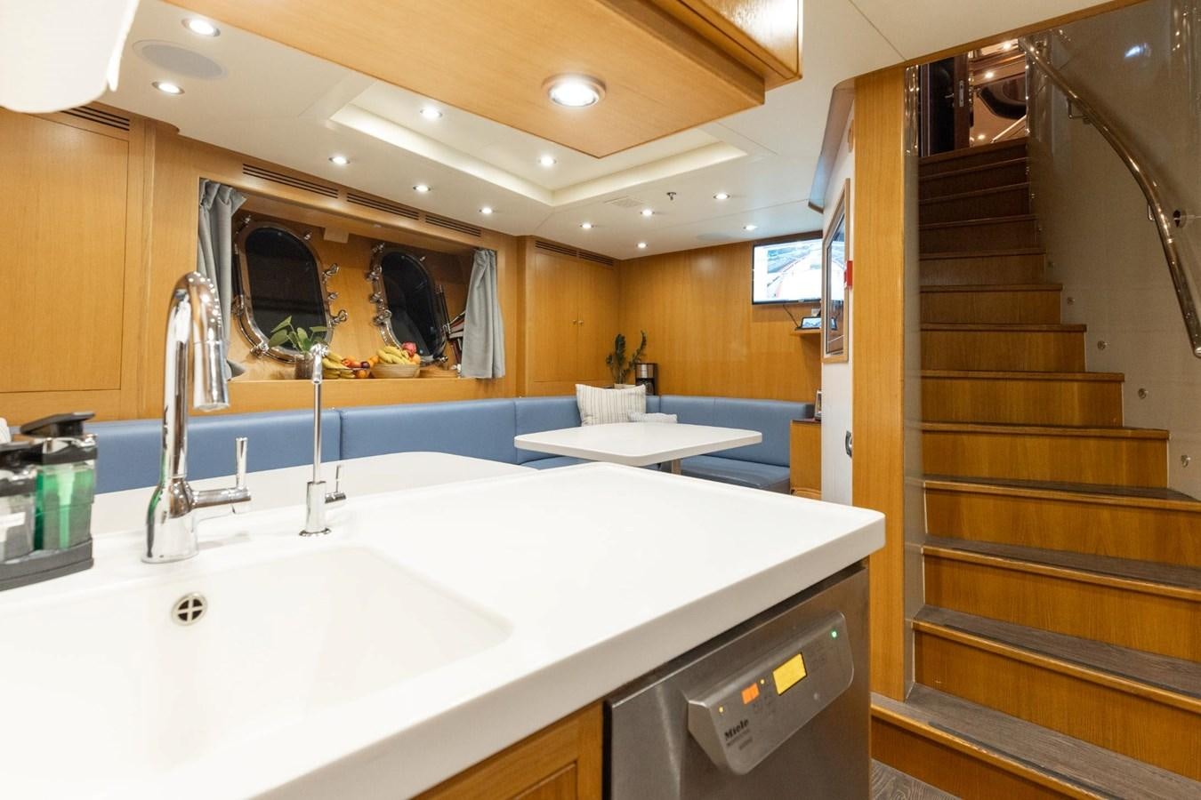 a bathroom with a sink and a mirror aboard LADY B Yacht for Sale