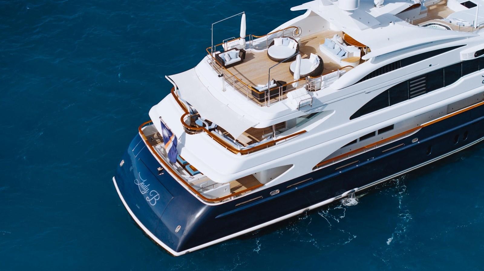 a large white boat in the water aboard LADY B Yacht for Sale