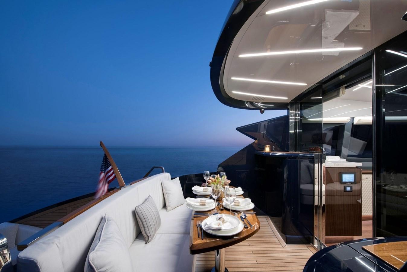 a room with a table and chairs aboard 2024 LAZZARA LSX 67 Yacht for Sale