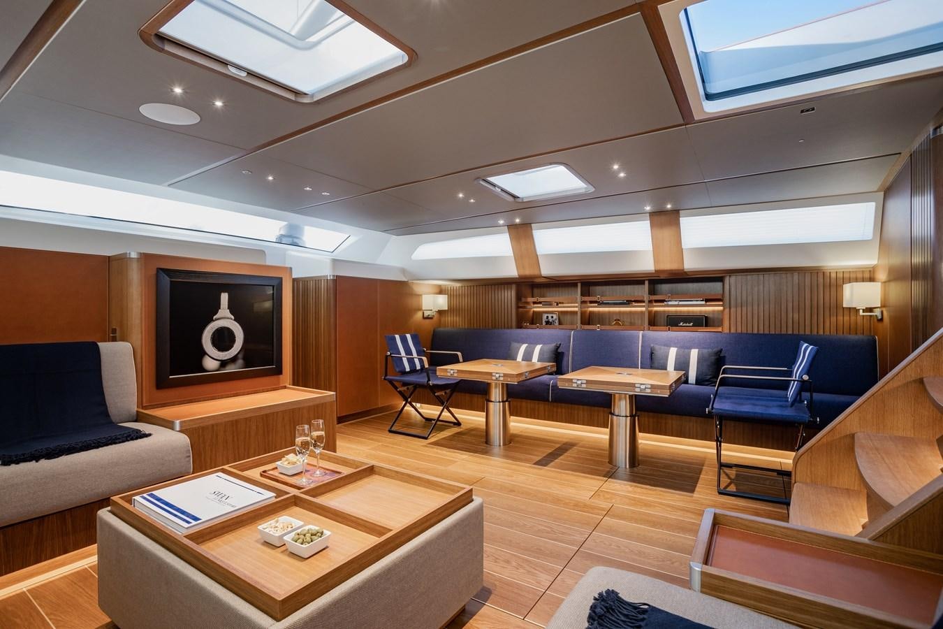 a room with a tv and a couch aboard HONEY RYDER Yacht for Sale