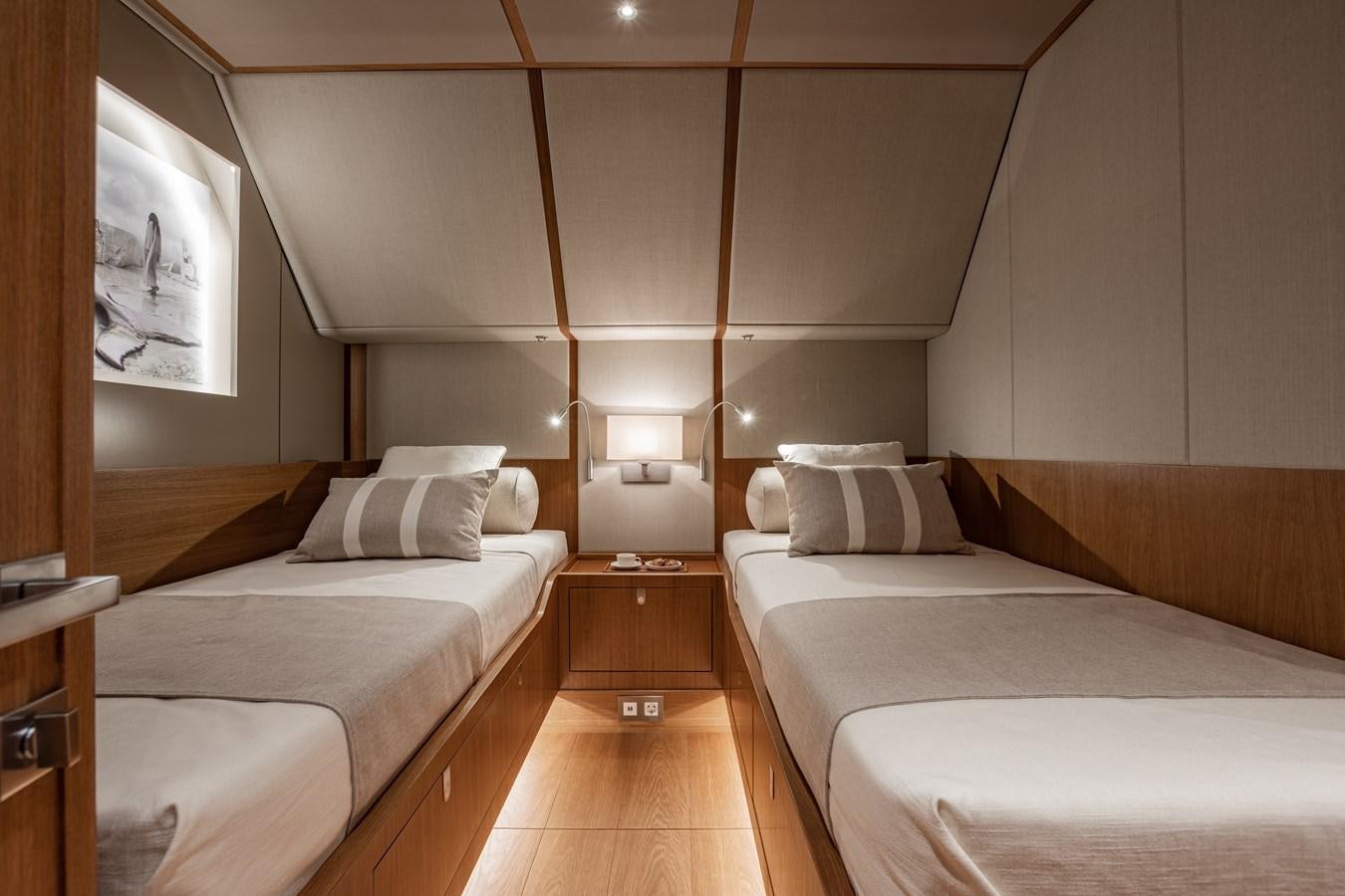 a room with two beds aboard HONEY RYDER Yacht for Sale