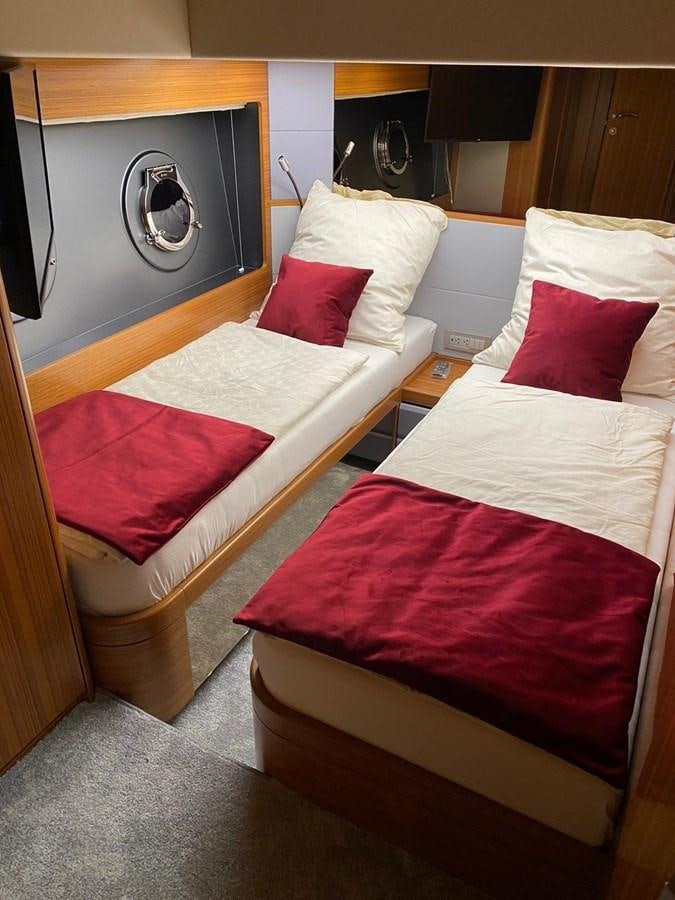 a couple of beds in a hotel room aboard OCEAN CLASS 68 Yacht for Sale