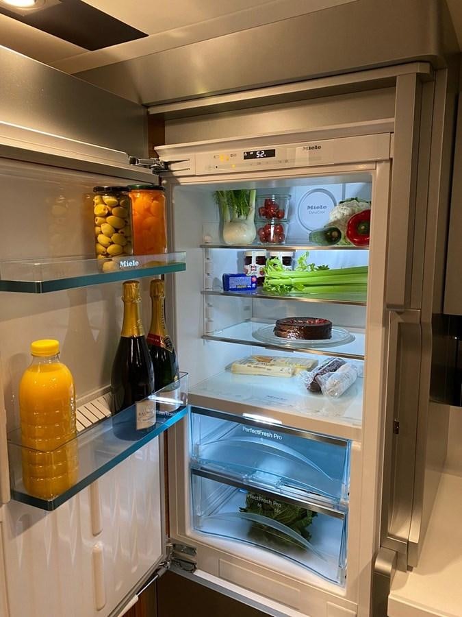 a refrigerator with food and drinks aboard OCEAN CLASS 68 Yacht for Sale