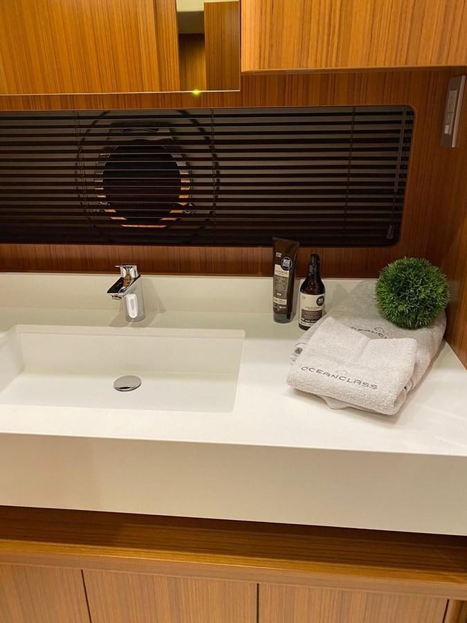a sink with a towel and a towel on it aboard OCEAN CLASS 68 Yacht for Sale