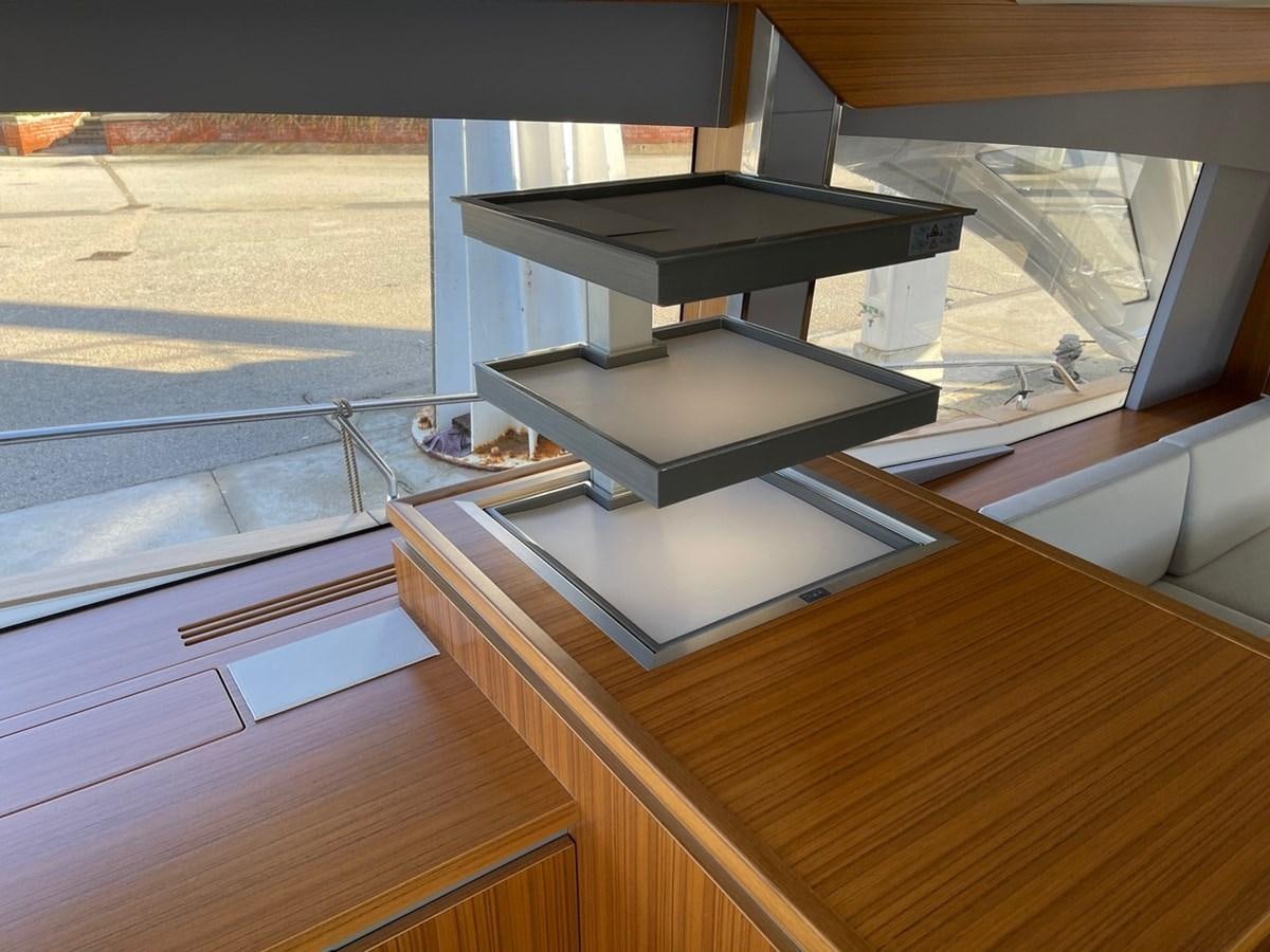 a black and silver object on a wooden surface aboard OCEAN CLASS 68 Yacht for Sale