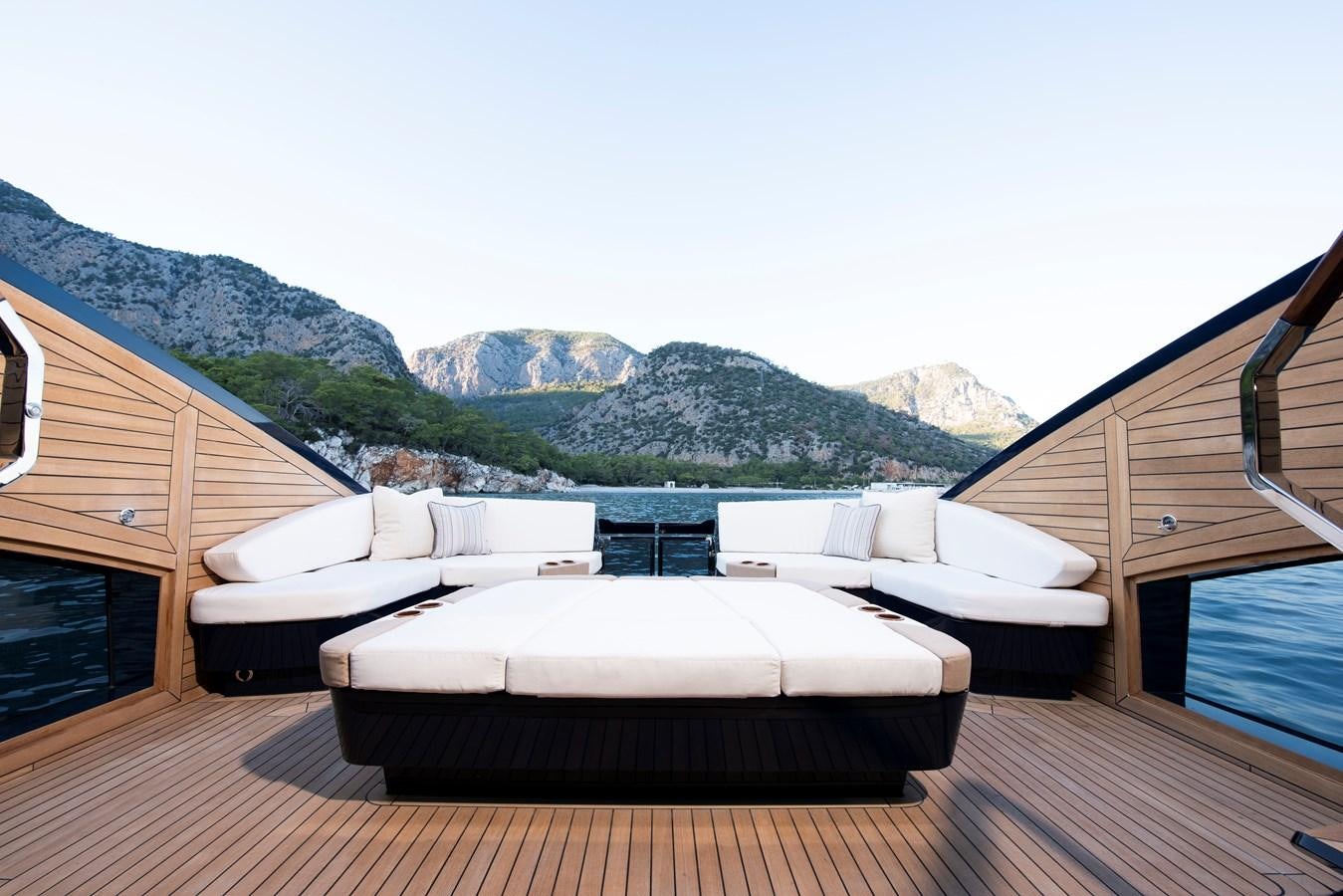 a deck with a view of mountains aboard LSX 67 SPORT EXPRESS Yacht for Sale