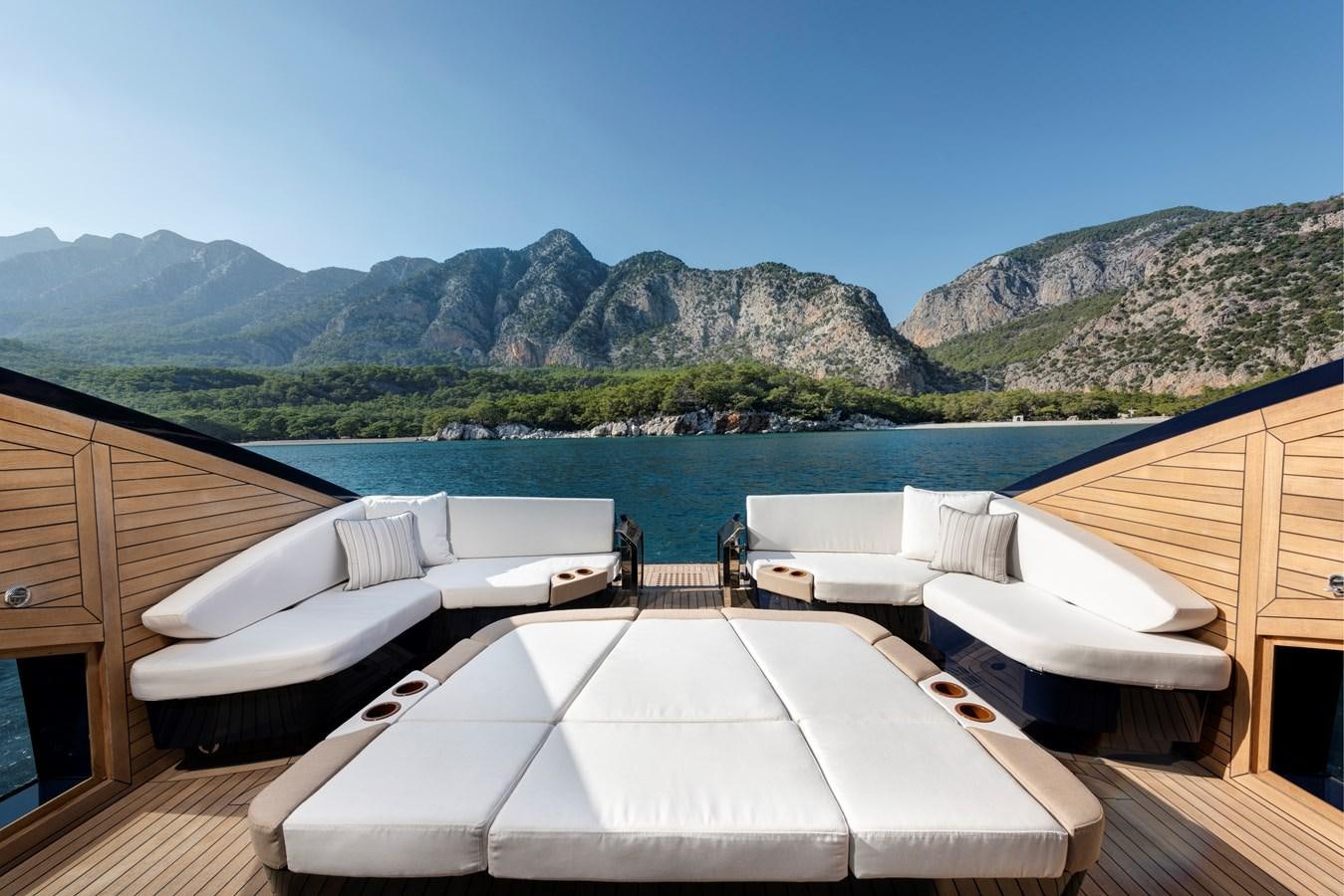 a large pool with a view of mountains and water aboard LSX 67 SPORT EXPRESS Yacht for Sale