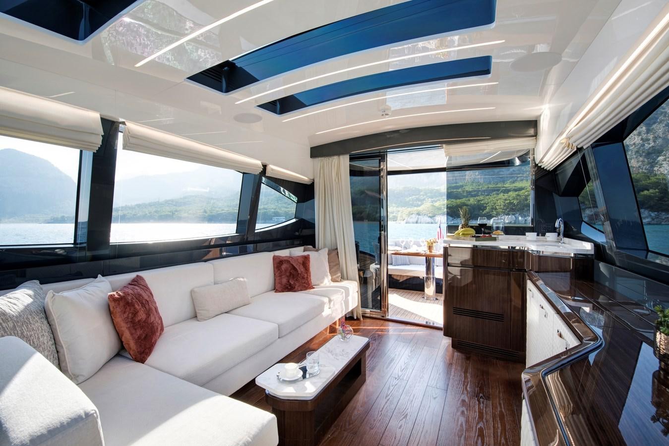 a living room with a large window aboard LSX 67 SPORT EXPRESS Yacht for Sale