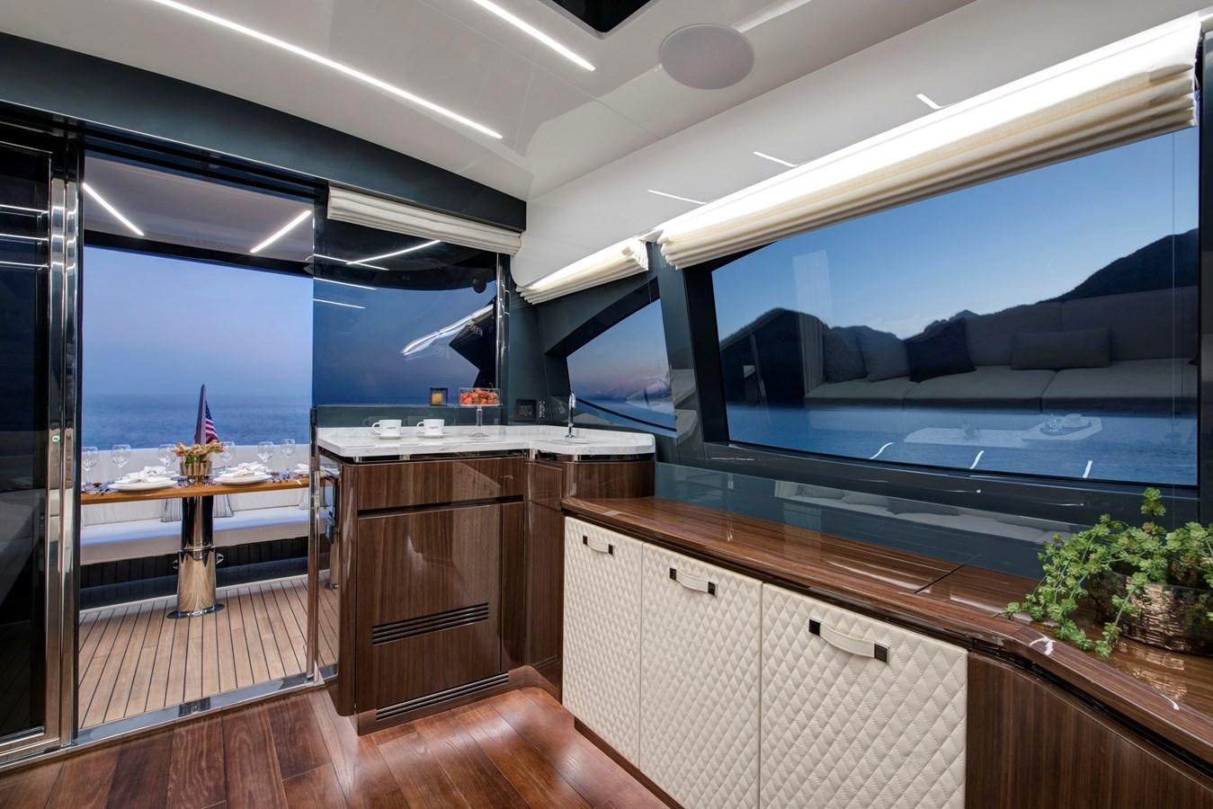 a kitchen with a large window aboard LSX 67 SPORT EXPRESS Yacht for Sale