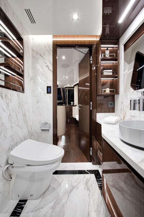 a bathroom with a sink and a toilet aboard LSX 67 SPORT EXPRESS Yacht for Sale