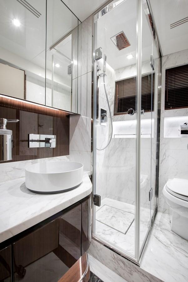 a bathroom with a sink and a shower aboard LSX 67 SPORT EXPRESS Yacht for Sale