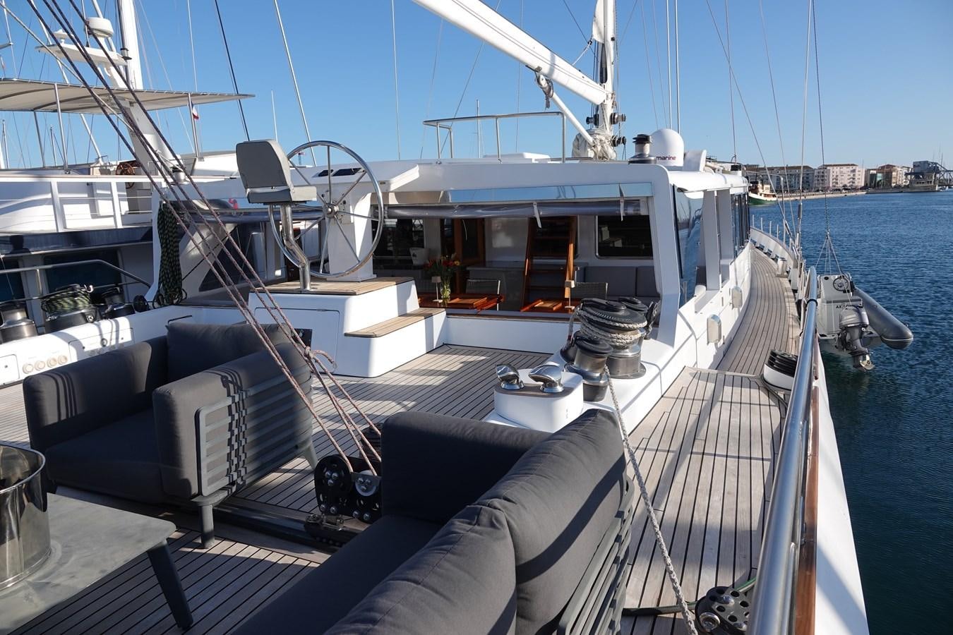 a boat with a deck and a deck with chairs on it aboard ONYX 2 Yacht for Sale