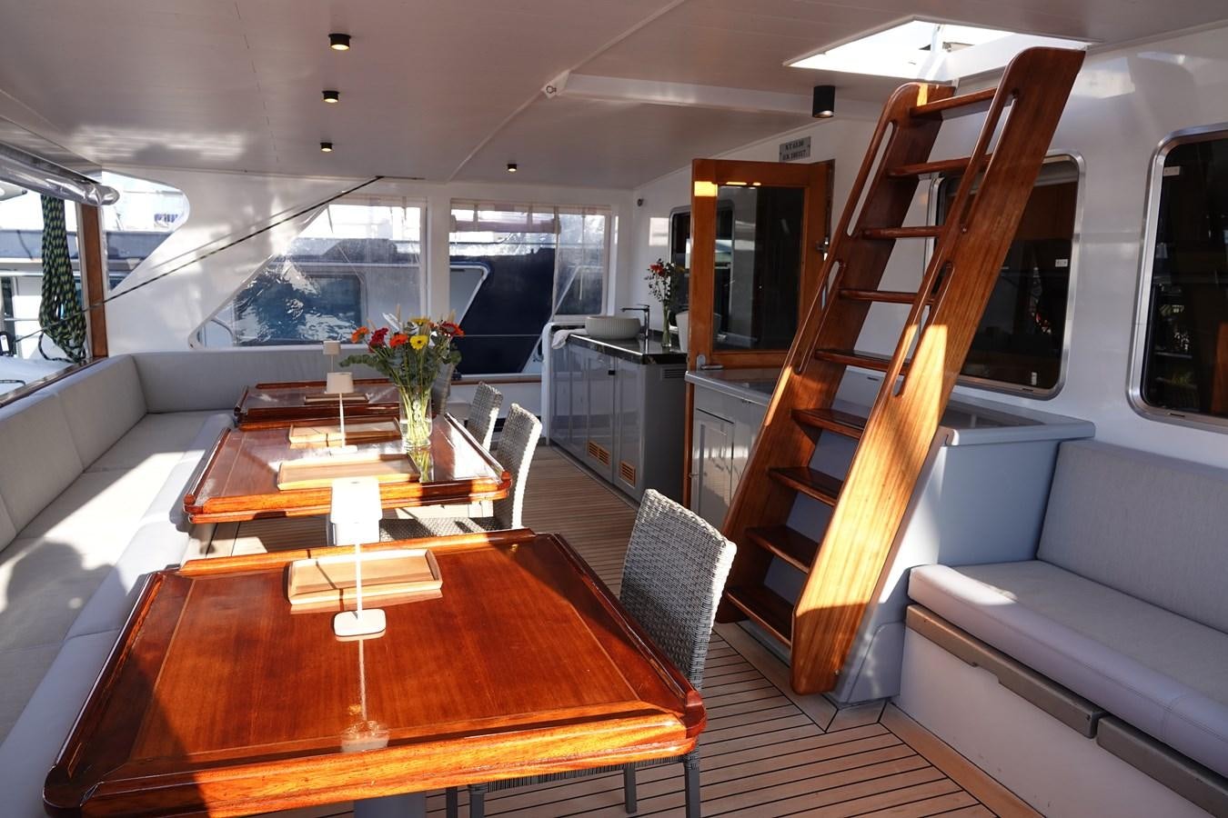 a living room with a table and chairs aboard ONYX 2 Yacht for Sale