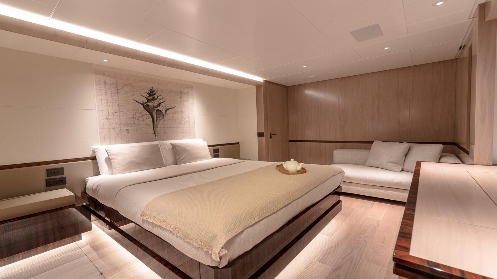 a large bed in a room aboard OCEANIC GRAND Yacht for Sale