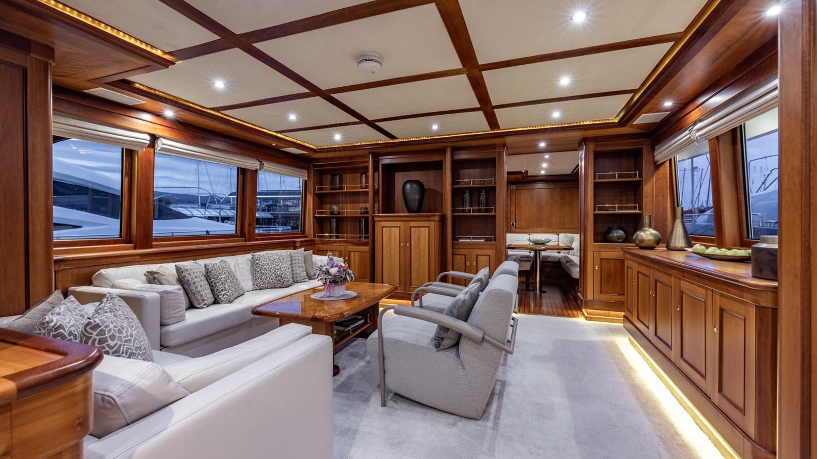 a living room with a couch and a table aboard SEA BREEZE II Yacht for Sale