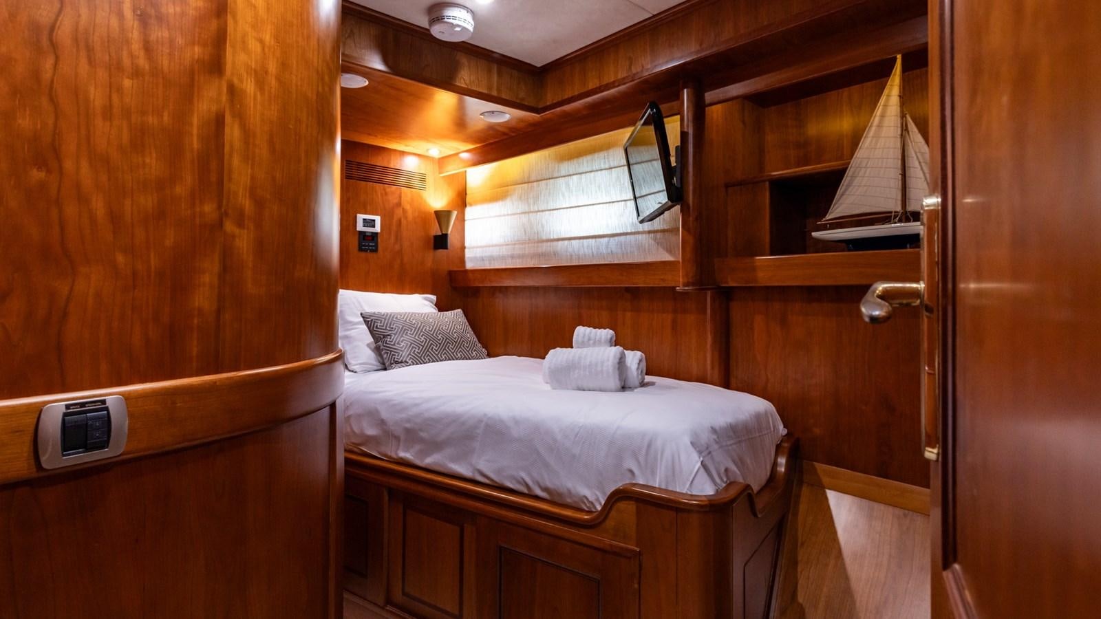a bed in a room aboard SEA BREEZE II Yacht for Sale