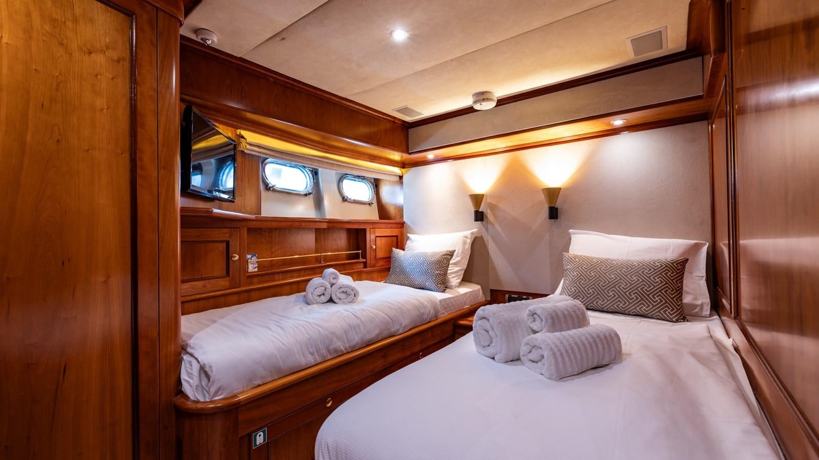 a room with two beds aboard SEA BREEZE II Yacht for Sale