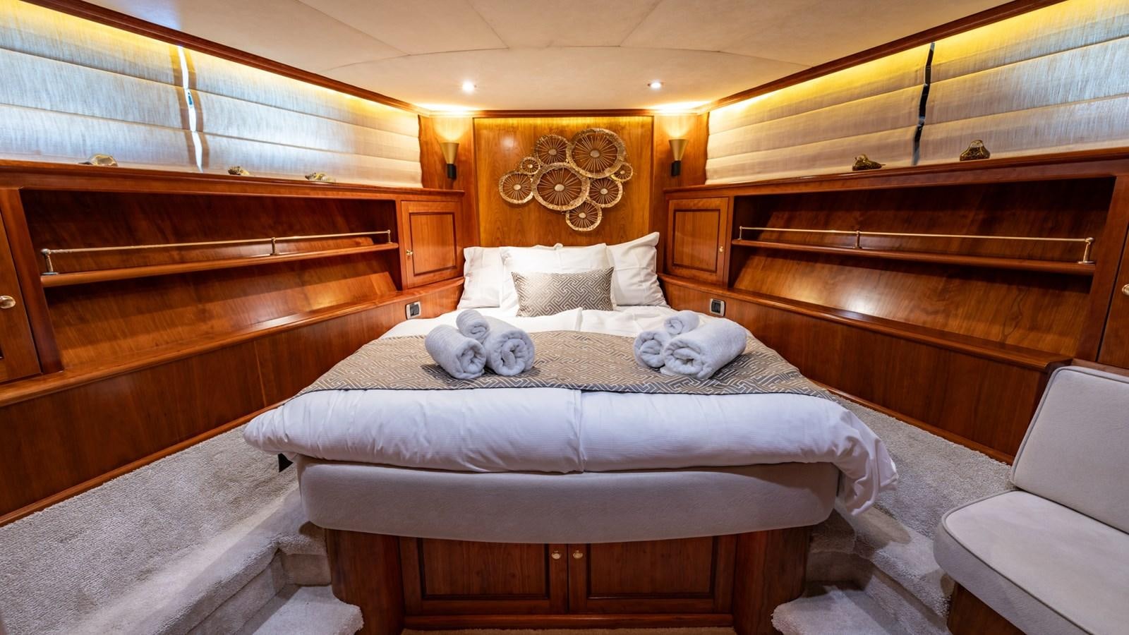 a large bed in a room aboard SEA BREEZE II Yacht for Sale