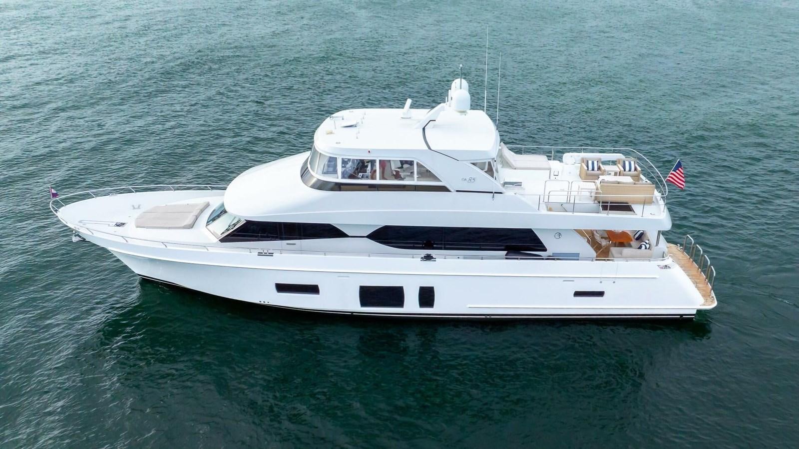 a white yacht on the water aboard CRUMDALE Yacht for Sale