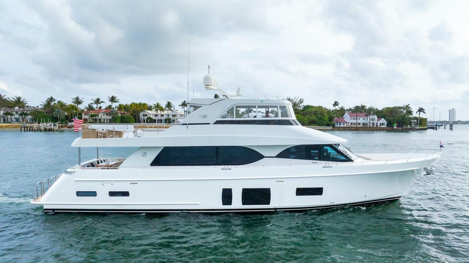 a white yacht in the water aboard CRUMDALE Yacht for Sale