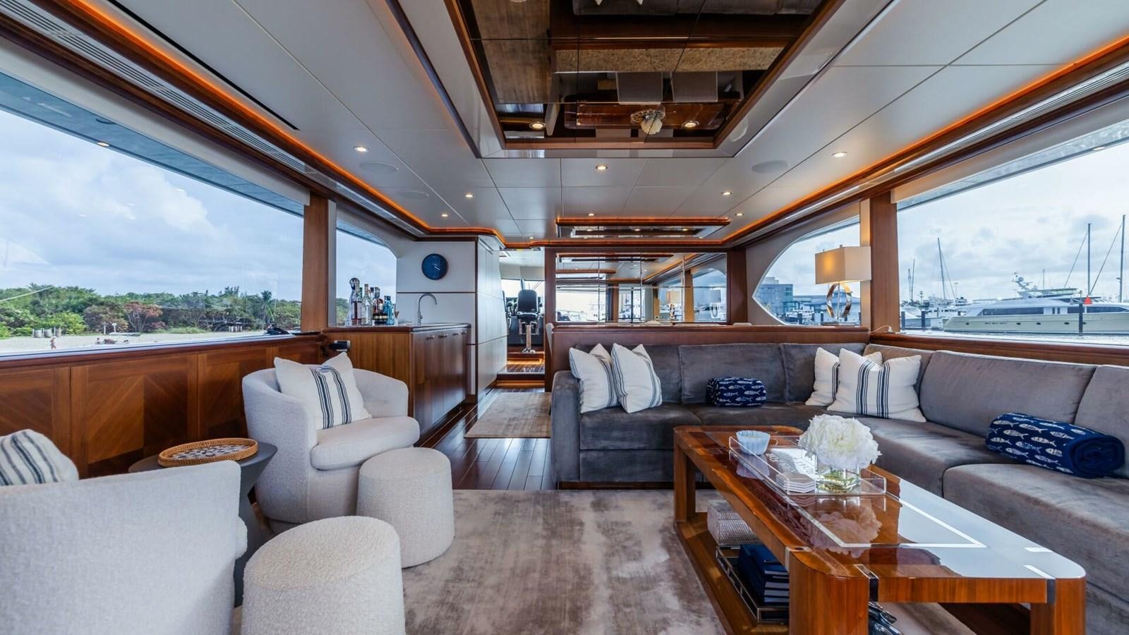a living room with a large window aboard CRUMDALE Yacht for Sale