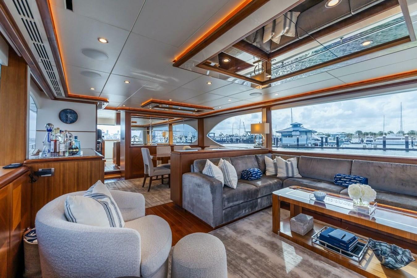 a living room with a large window aboard CRUMDALE Yacht for Sale