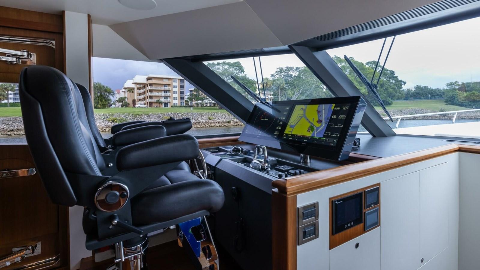 a car with a screen and a computer on it aboard CRUMDALE Yacht for Sale