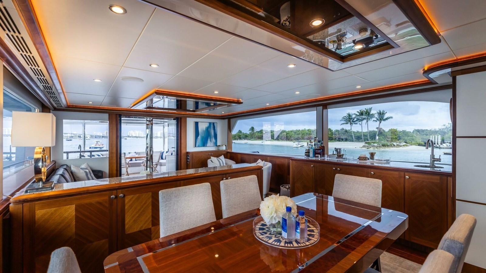 a room with a table and chairs aboard CRUMDALE Yacht for Sale