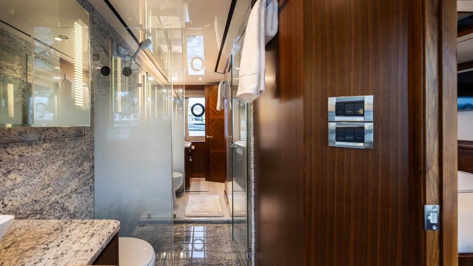 a bathroom with a shower aboard CRUMDALE Yacht for Sale