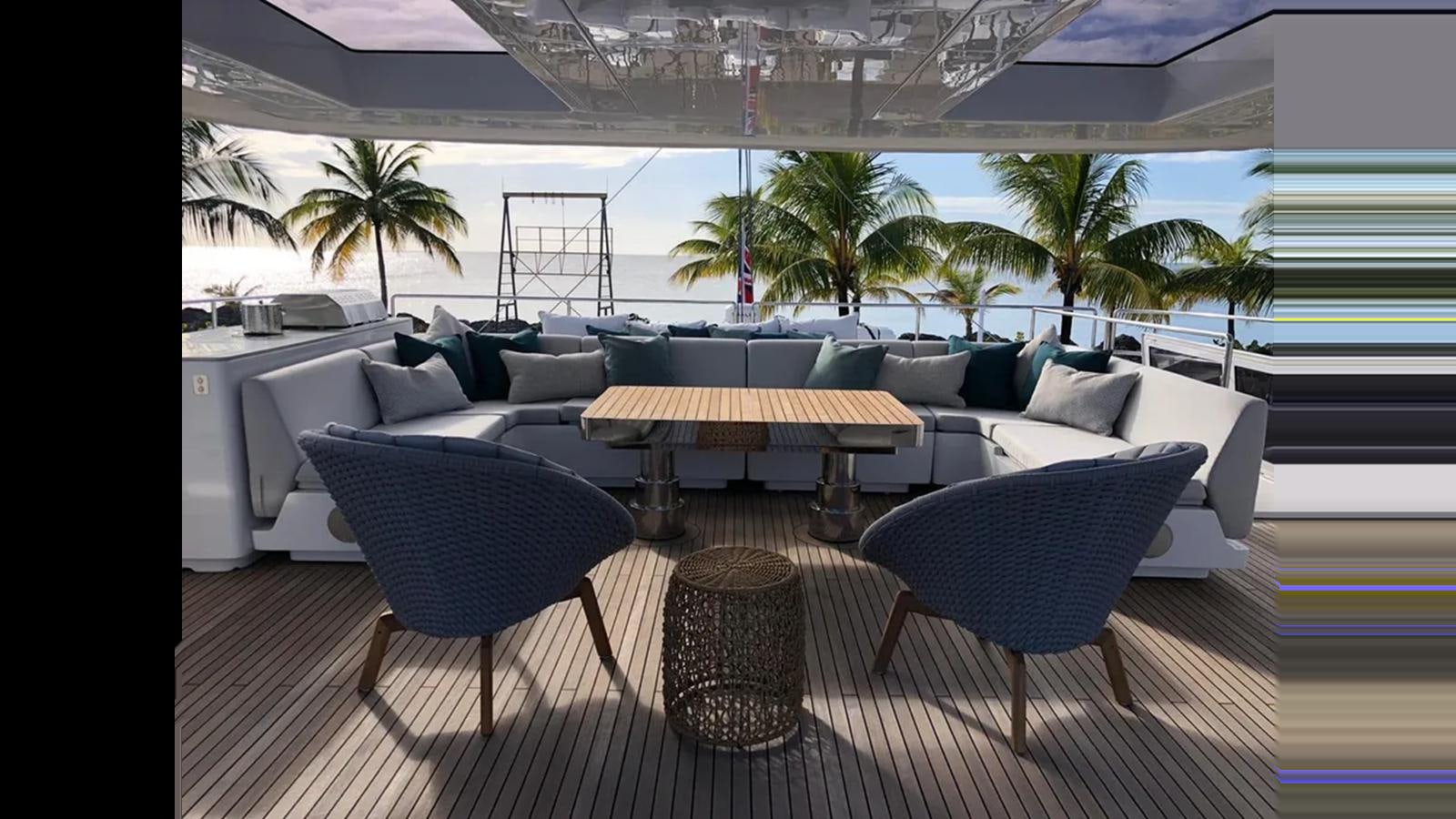 a room with a table and chairs aboard SEACLUSION Yacht for Sale
