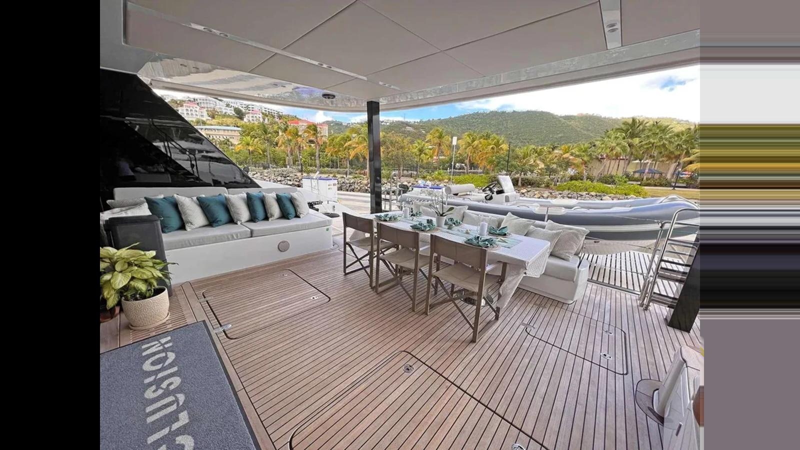 a patio with a table and chairs aboard SEACLUSION Yacht for Sale