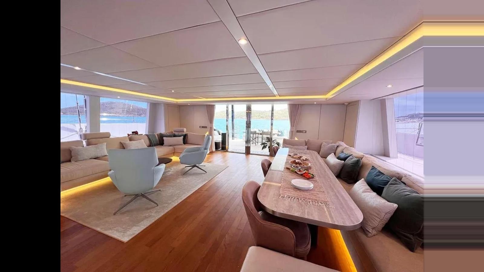 a living room with a large window aboard SEACLUSION Yacht for Sale