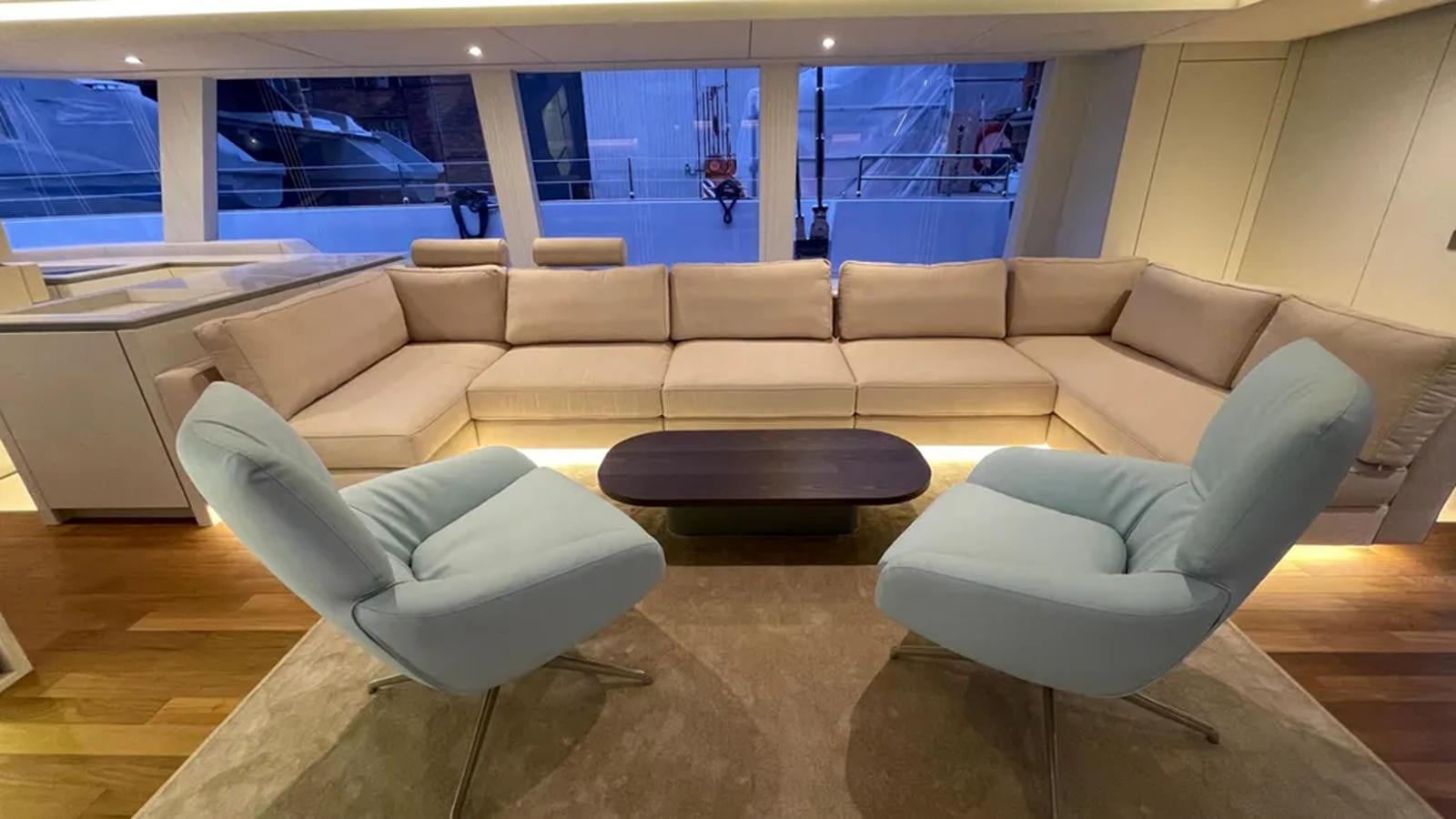 a room with couches and chairs aboard SEACLUSION Yacht for Sale