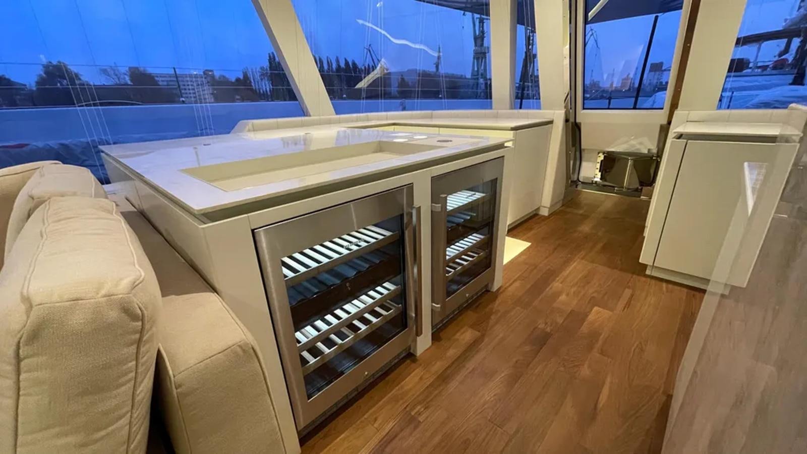 a room with a large window and a couch aboard SEACLUSION Yacht for Sale