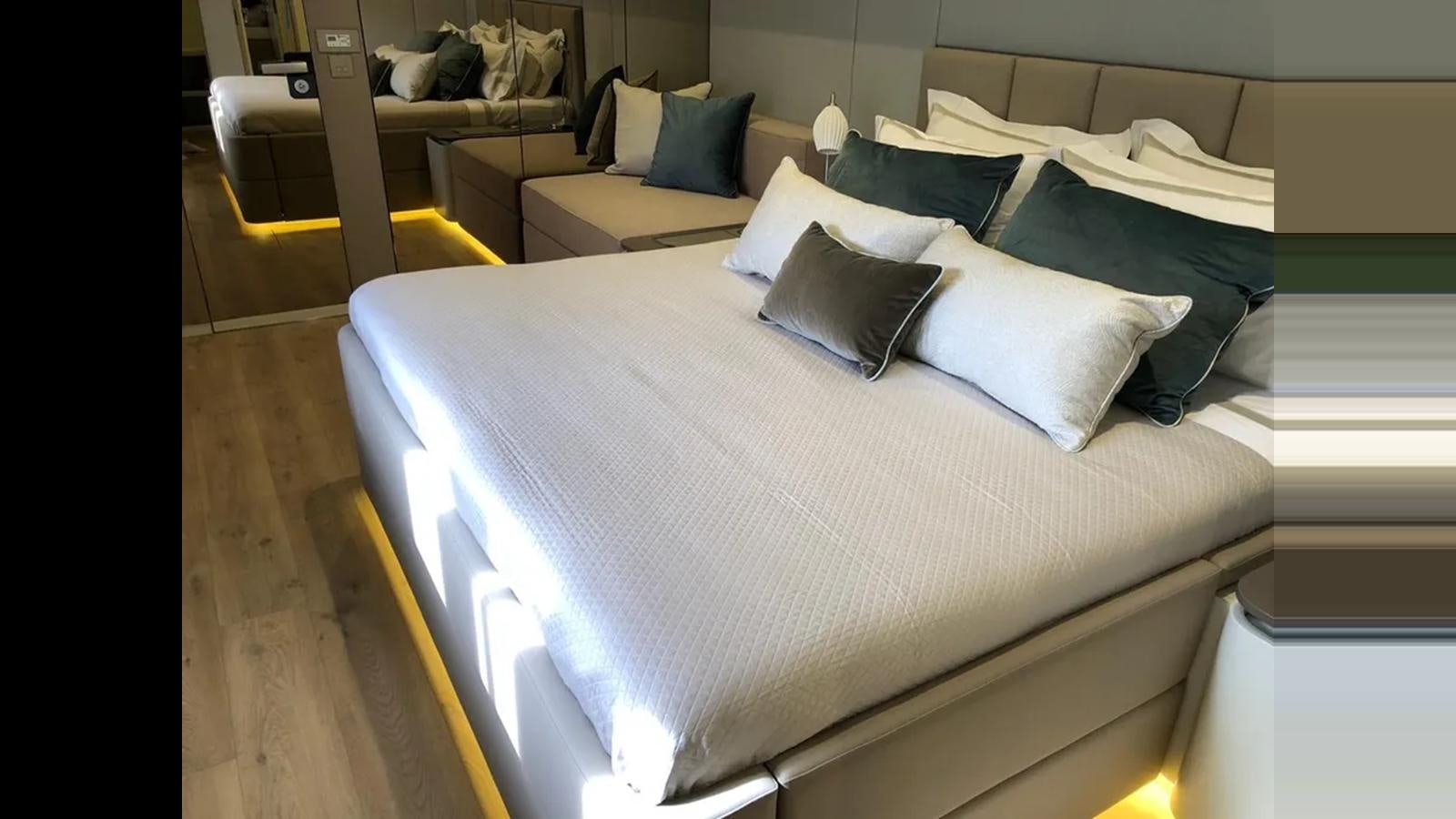 a bed with white sheets aboard SEACLUSION Yacht for Sale
